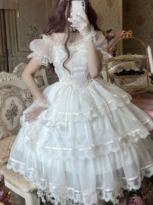 white sweet lolita jsk dress sleeveless front view model wearing pearl beaded straps choker lace bow embellishment fairy dress aesthetic