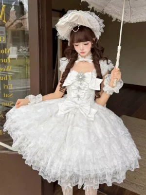 White Sweet Lolita sleeveless JSK dress front full-body view with square neckline tiered ruffled skirt and front bow chest ornament vintage aesthetic