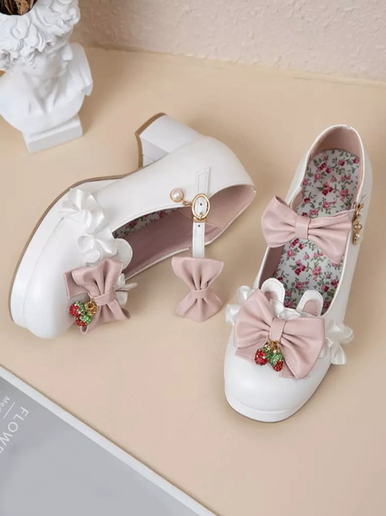 White Sweet Lolita Mary Jane pumps flat lay desktop display showing pink bows, strawberry charms, floral printed insole, and chunky block heel design