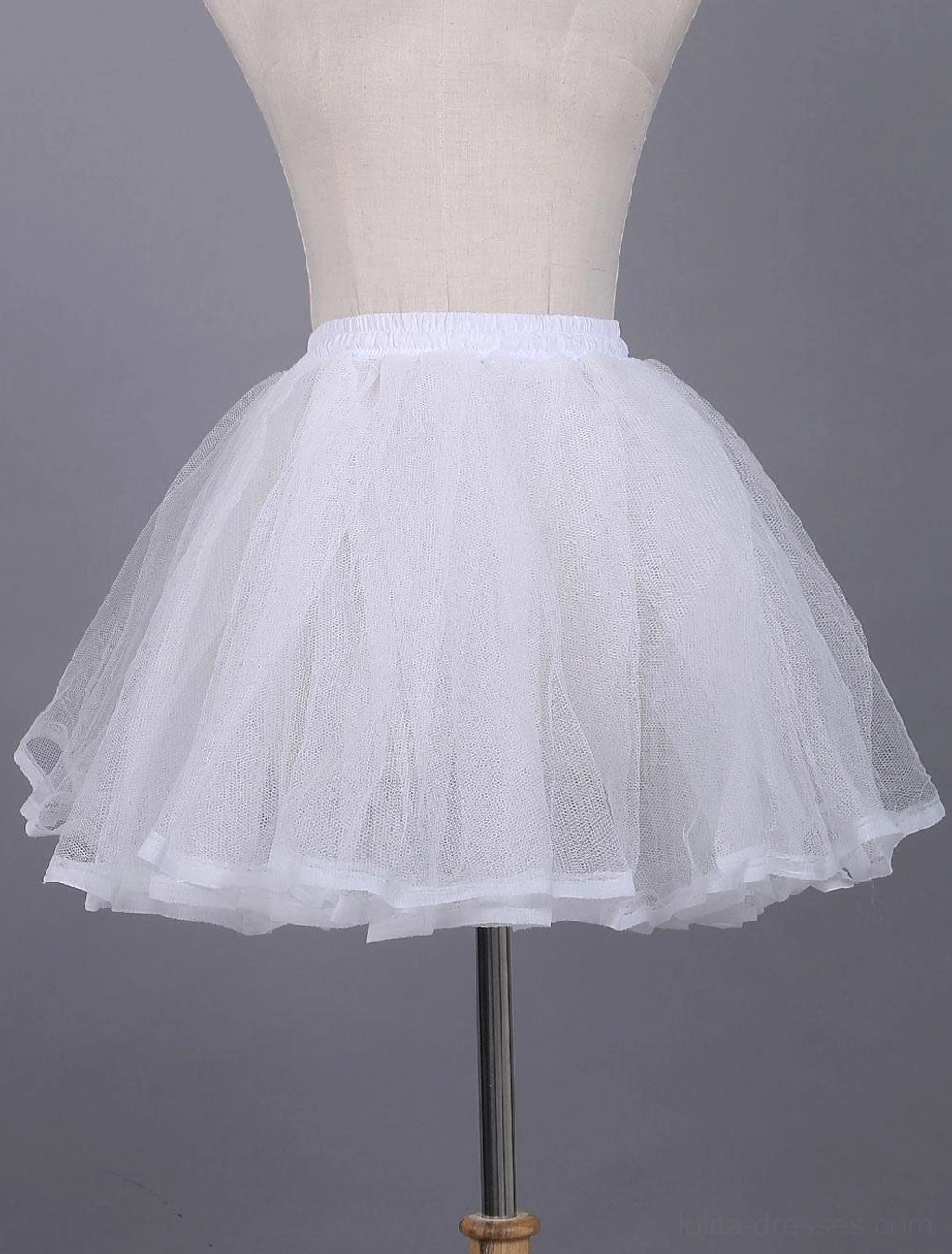 White lace tulle lolita petticoat front view displayed on dress form with elastic waistband and layered sheer tulle construction showing satin hem trim