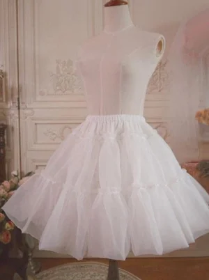 White tulle lolita petticoat with ruffled pleated layers displayed on dress form mannequin, front view showing elastic waistband and voluminous puffy silhouette characteristic of authentic lolita fashion