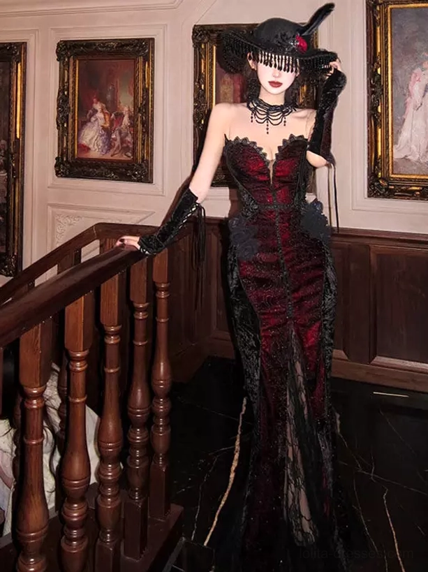 Wine red black lace Gothic Lolita strapless dress with coordinating wide-brimmed hat and choker three-quarter standing view vintage interior backdrop