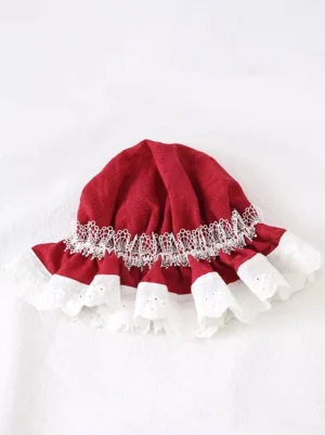 Wine red Lolita tea party bonnet flat lay front view, displaying white scalloped lace trim and dramatic ruffled hem detail on pristine background