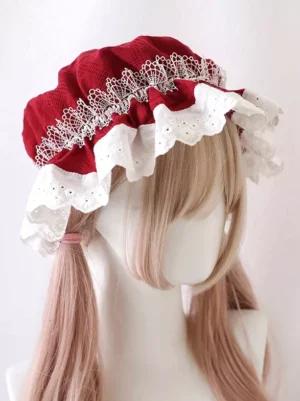 Wine red Victorian Sweet Lolita bonnet with white embroidered scalloped lace ruffles, worn by blonde wig mannequin in three-quarter view, showcasing ornate Rococo design
