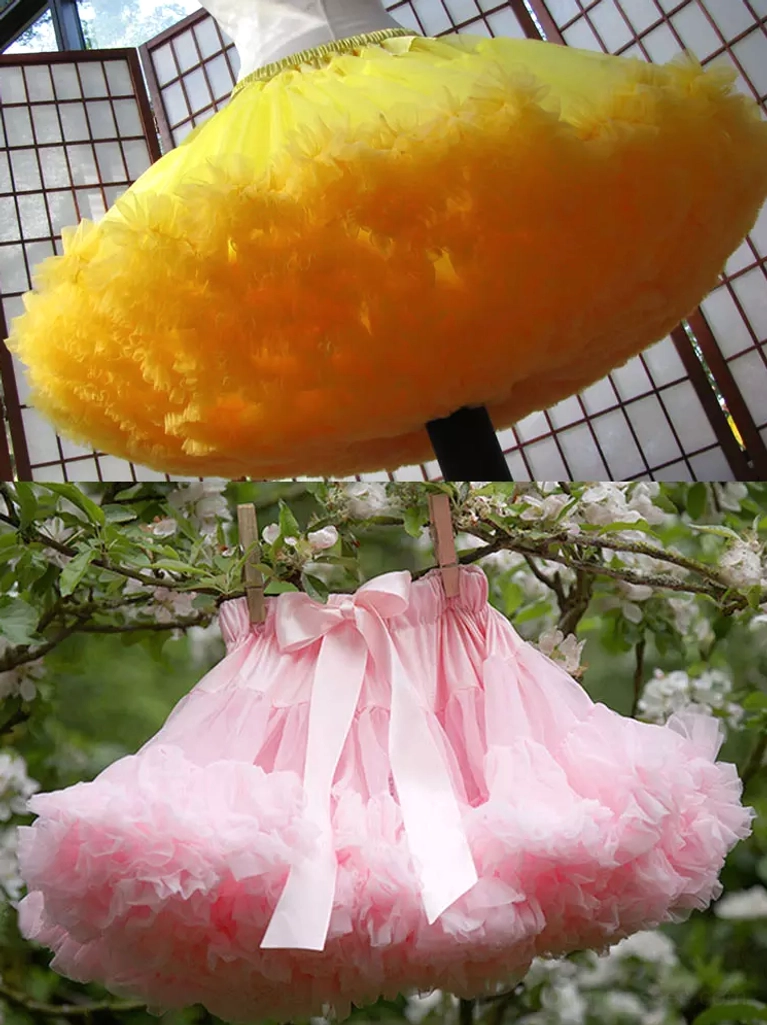 Yellow ruffled lolita petticoat overhead flat view grid window background golden yellow color full fluffy skirt silhouette